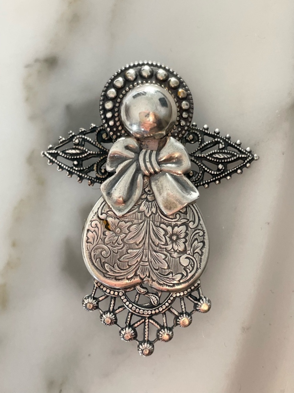 Ornate Silver-Tone Angel Brooch with Filigree Bow